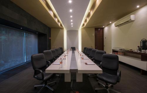 a large conference room with a long table and chairs at Victoria Ejecutivo in Guadalajara