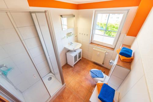 a bathroom with a shower and a sink at Haus Jasmund in Binz