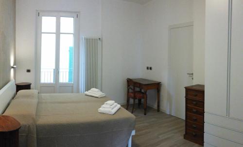 Posteľ alebo postele v izbe v ubytovaní Appartamento i Tulipani - 1