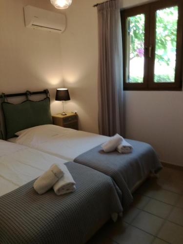 Ένα ή περισσότερα κρεβάτια σε δωμάτιο στο Amari Krini House