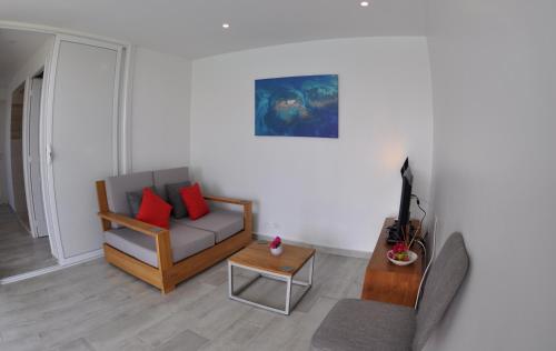 Posezení v ubytování L'Hacienda - Vue Mer et piscine privée