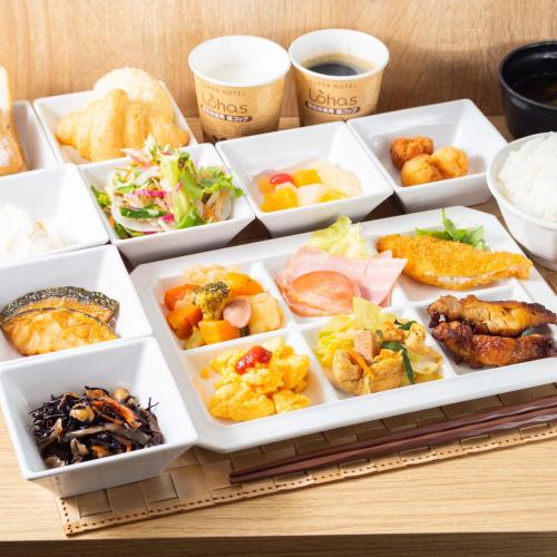 a tray of different types of food on a table at Super Hotel Okinawa Nago in Nago