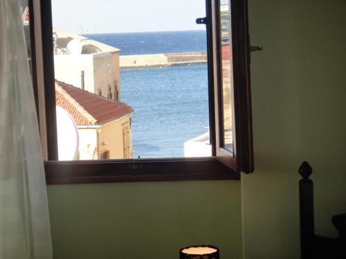 an open window with a view of the ocean at Narkissos 'SUPERB' in Chania Town