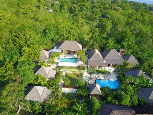 an aerial view of a villa with a resort at Pandana Boutique Hotel in Nusa Lembongan