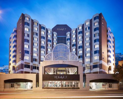 
a large building with a clock on top of it at Hyatt Regency Perth in Perth
