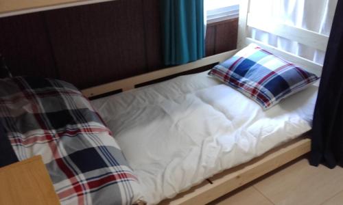 Ένα ή περισσότερα κρεβάτια σε δωμάτιο στο kaeru Guest house
