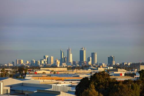 a view of a city with tall buildings at Quest Innaloo in Perth
