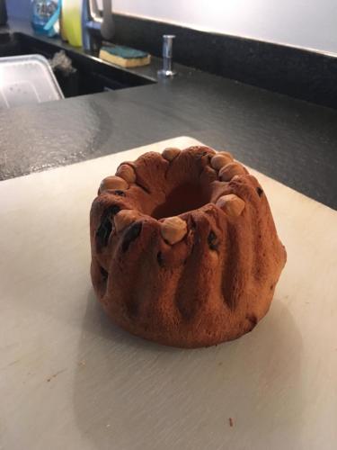a doughnut sitting on top of a table at La Maison d'Emilie in Pfaffenheim