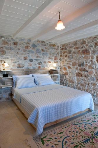 Ένα ή περισσότερα κρεβάτια σε δωμάτιο στο Limeni Villa