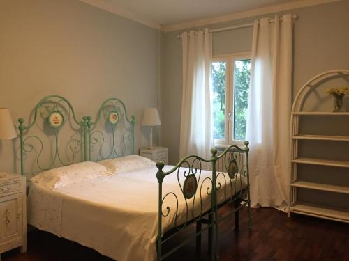 Llit o llits en una habitació de B&B Villa al Parco