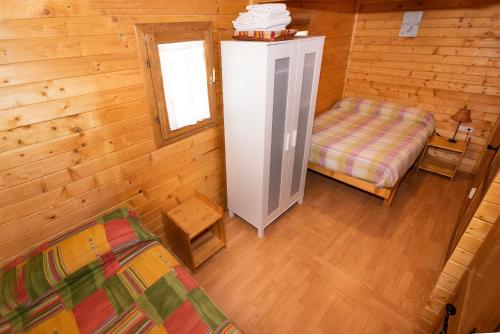 Postel nebo postele na pokoji v ubytování Cabañas Vallecino