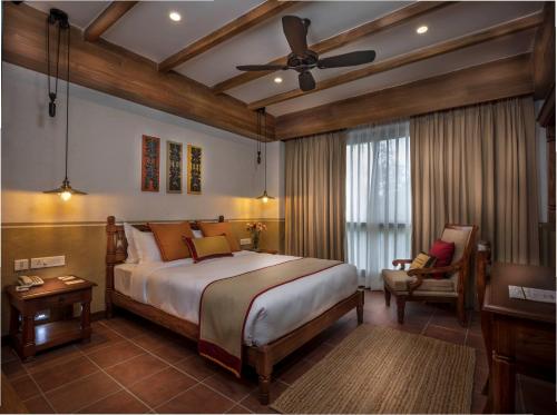 Ένα ή περισσότερα κρεβάτια σε δωμάτιο στο Nepali Ghar Hotel