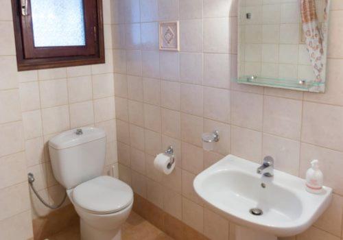 a bathroom with a toilet and a sink at Polichni in Leonidion