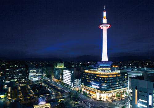 a view of a city at night with a tv tower at AB Hotel Kyoto Shijo Horikawa in Kyoto