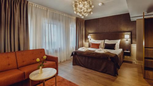Säng eller sängar i ett rum på Clarion Collection Hotel Grand Bodø