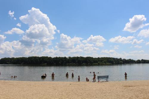 a group of people in the water at a beach at Jihoceska Pohoda in Třeboň