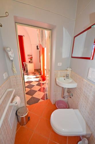 a bathroom with a toilet and a sink at Antica Terrazza in Morciano di Leuca