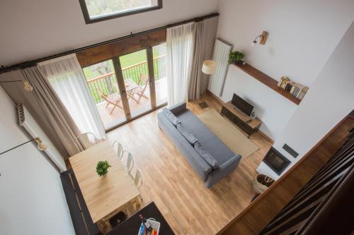 an overhead view of a living room with a couch and a table at Os Feleitos in Orellán