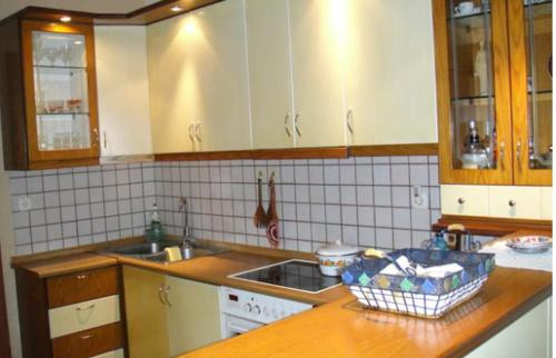 a kitchen with a sink and a counter top at Lovely house with garden at an excellent location! in Agria