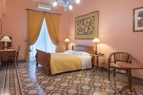 Ένα ή περισσότερα κρεβάτια σε δωμάτιο στο palazzo pantaleo