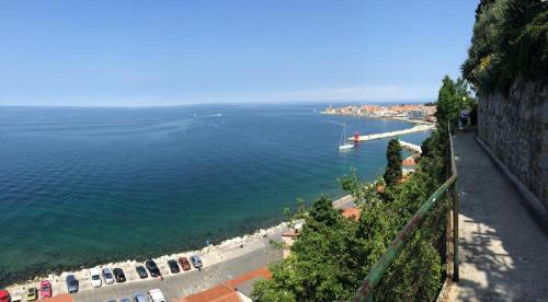 a view of a body of water from a cliff at Apartments Mirjana in Piran
