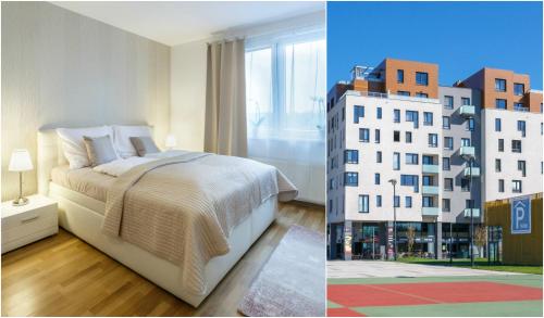 a bedroom with a bed and a tall building at Golden Apartments Rezidence Nová Karolina in Ostrava