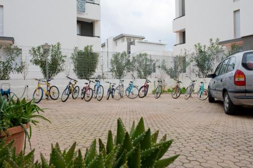 a row of bikes parked next to a fence at B&B Nova Siri in Nova Siri Marina
