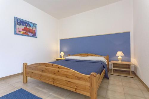 Postel nebo postele na pokoji v ubytování Appartamento Mimosa