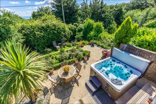 an aerial view of a backyard with a hot tub at Sea View Holiday Flat - Covehurst Bay in Hastings