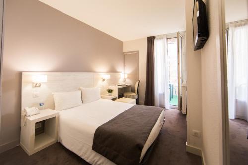 Un ou plusieurs lits dans un hébergement de l'établissement Hotel Cannes Croisette