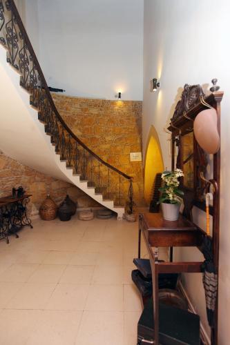 a hallway with a spiral staircase in a building at Centrum Hotel - City Center in Nicosia