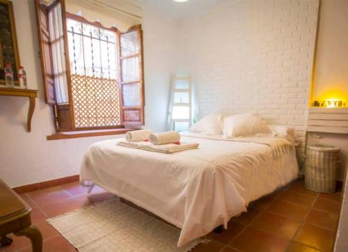 Postel nebo postele na pokoji v ubytování Realejo Príncipe