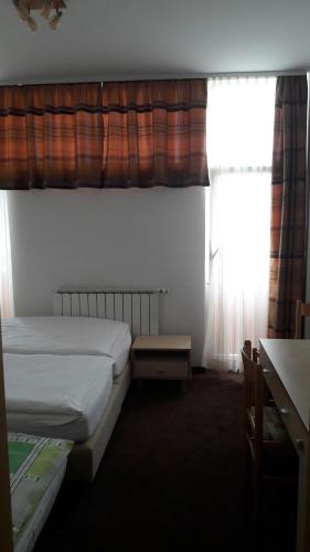 Postel nebo postele na pokoji v ubytování Rooms K