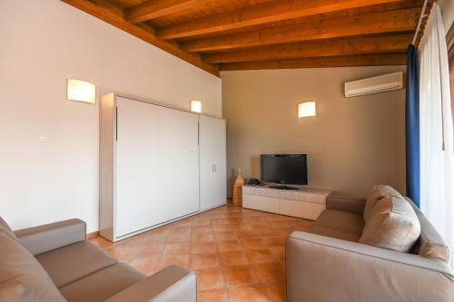 TV o dispositivi per l'intrattenimento presso Residence Corte Ferrari -Ciao Vacanze-