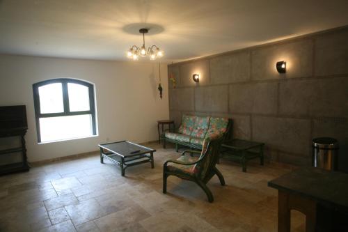 a living room with a couch and a table at Domaine de la Vidalle in Vendres