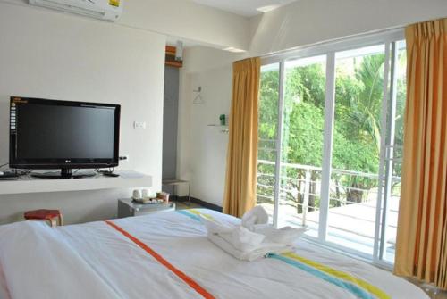Postel nebo postele na pokoji v ubytování O.U.M. Hotel - โรงแรมโอยูเอ็ม