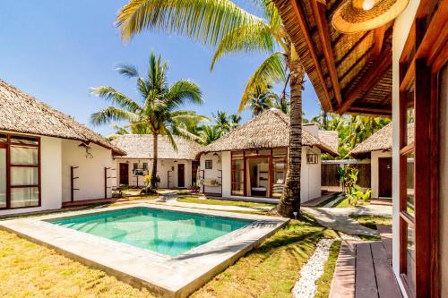 an exterior view of a villa with a swimming pool at Blauset Two in General Luna