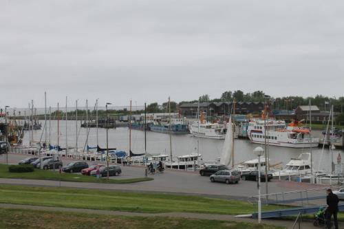 a marina with alot of boats in the water at Vier Jahreszeiten Bensersiel in Bensersiel