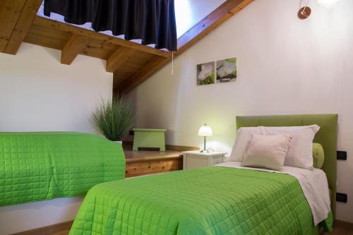 เตียงในห้องที่ Stella Marina 5