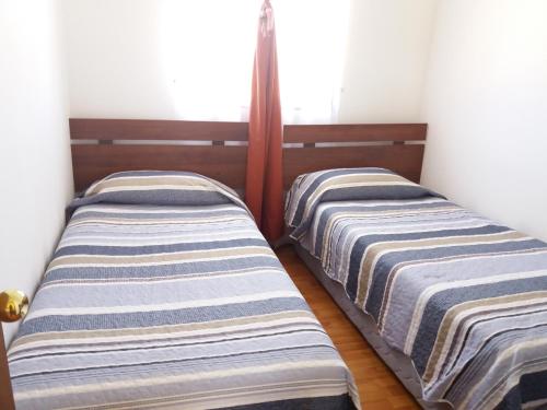 Llit o llits en una habitació de Cabañas M y M Frutillar