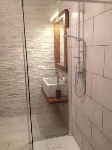 a bathroom with a sink and a shower at Domus Antiqua San Lorenzo in Genova