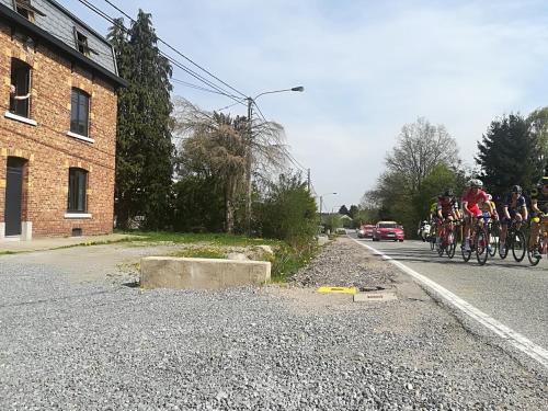 a group of people riding bikes down a road at Gite Terre de ciel in Ferrières