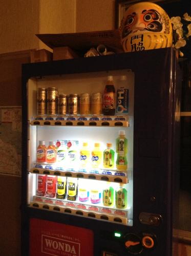 an open refrigerator filled with lots of drinks at Kadowakikan in Nozawa Onsen