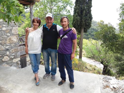 a man and a woman posing for a picture at San Georgio Hotel in Tsoútsouros