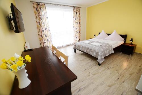 Кровать или кровати в номере Neptun