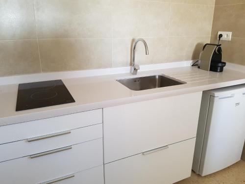 A kitchen or kitchenette at Viviendas Es Carritx