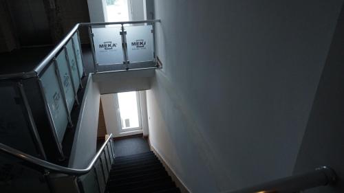 a stairway with a stair railing and a window at Meka Hotel in Dragash