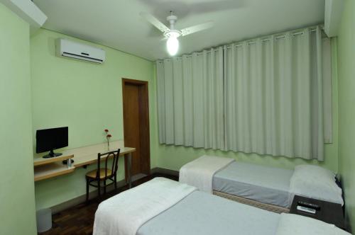 Llit o llits en una habitació de Hotel Ivo De Conto