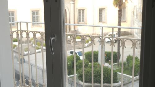 a view of a courtyard from a window at Casa Duomo in Aversa