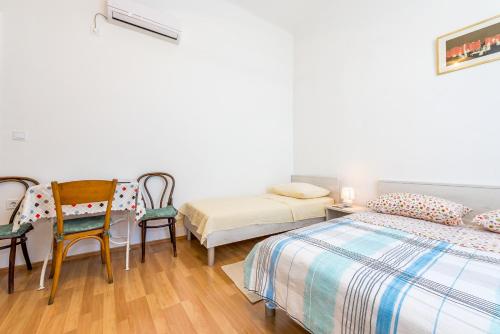 Katil atau katil-katil dalam bilik di Apartmani Rina